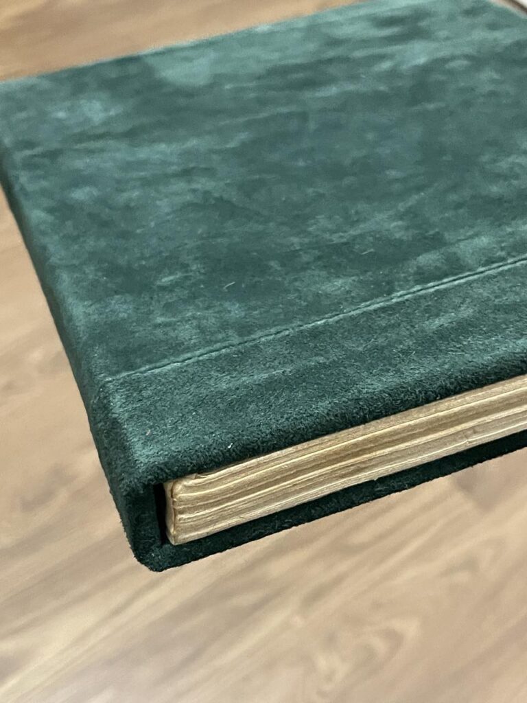 book with green leather cover